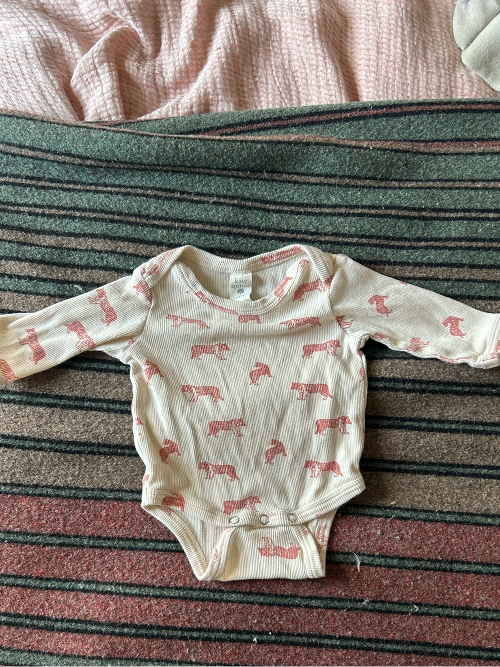 Kate Quinn Cream Baby One-Piece with Red Tiger Print